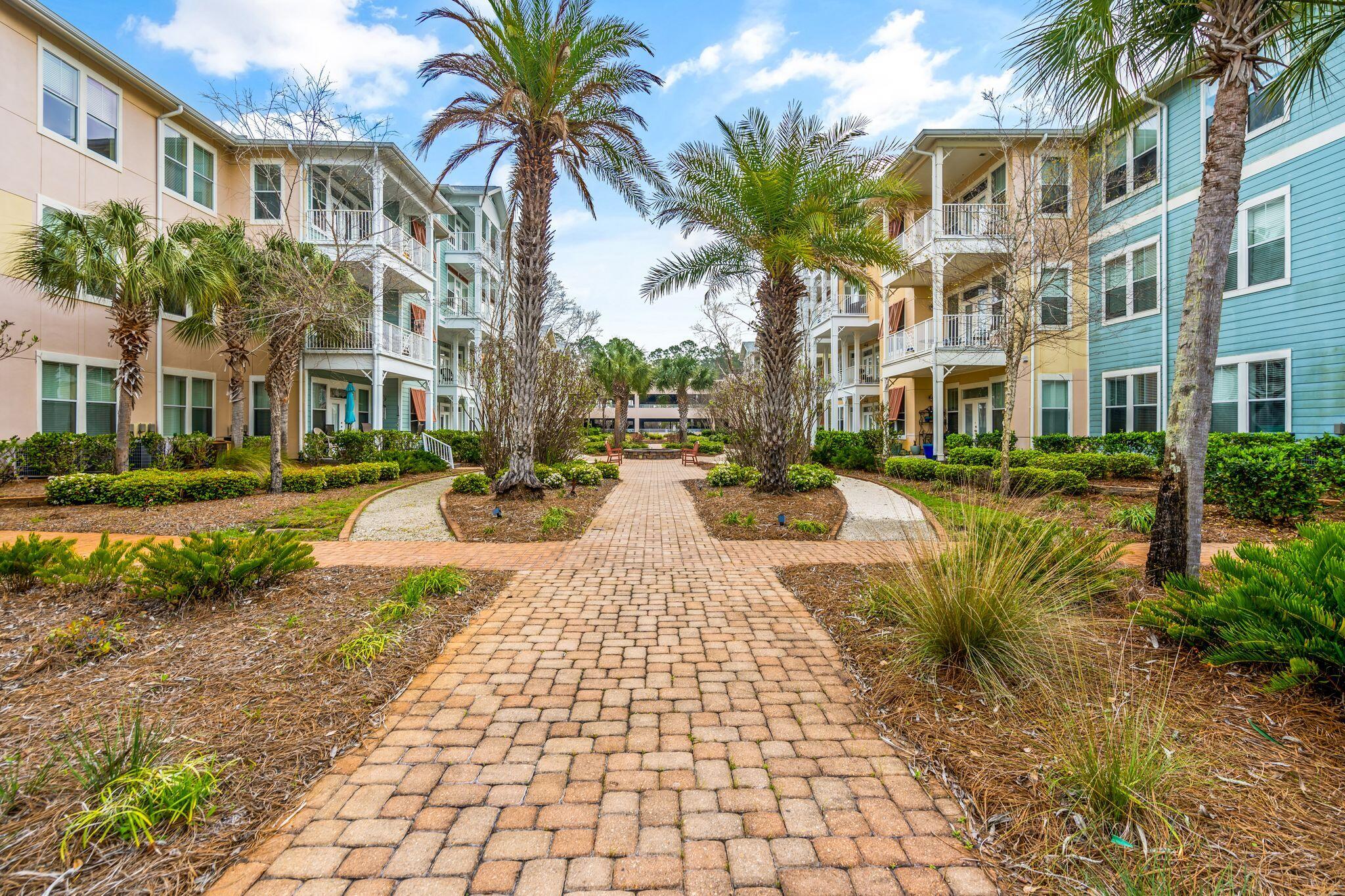 8700 Front Beach Road, Unit 6310 Panama City Beach, FL 32407 - Photo 33 of 42 a view of a building with a yard