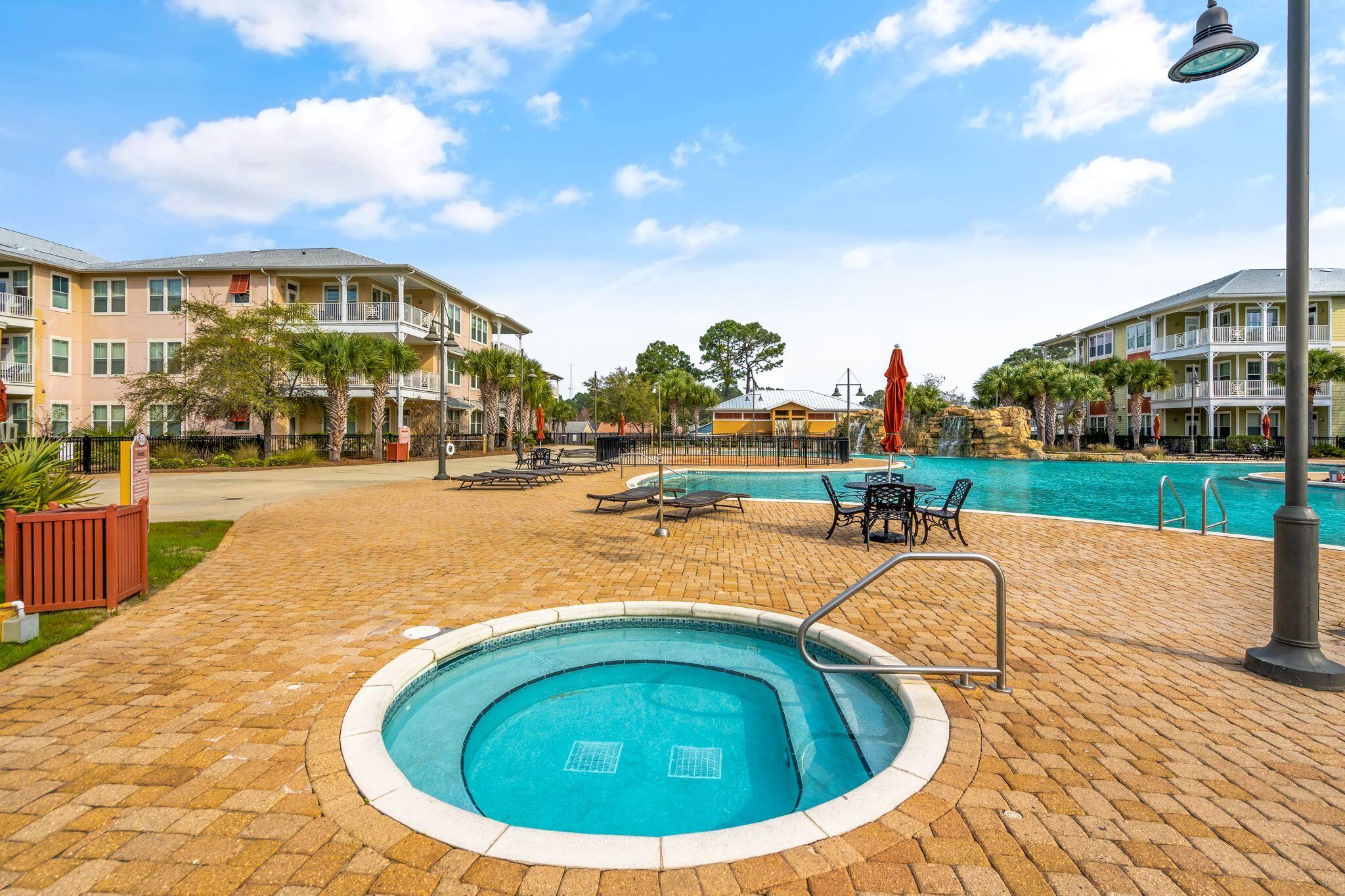 8700 Front Beach Road, Unit 6310 Panama City Beach, FL 32407 - Photo 39 of 42 a view of swimming pool with outdoor seating and yard in back