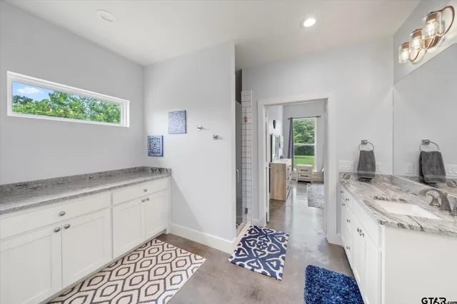 a kitchen with a sink and a refrigerator