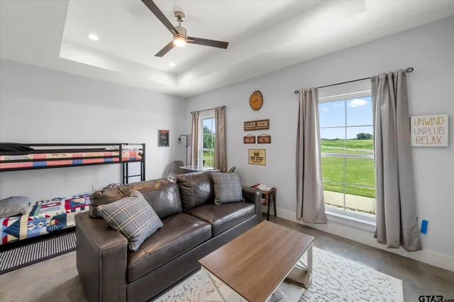 a living room with furniture and a window