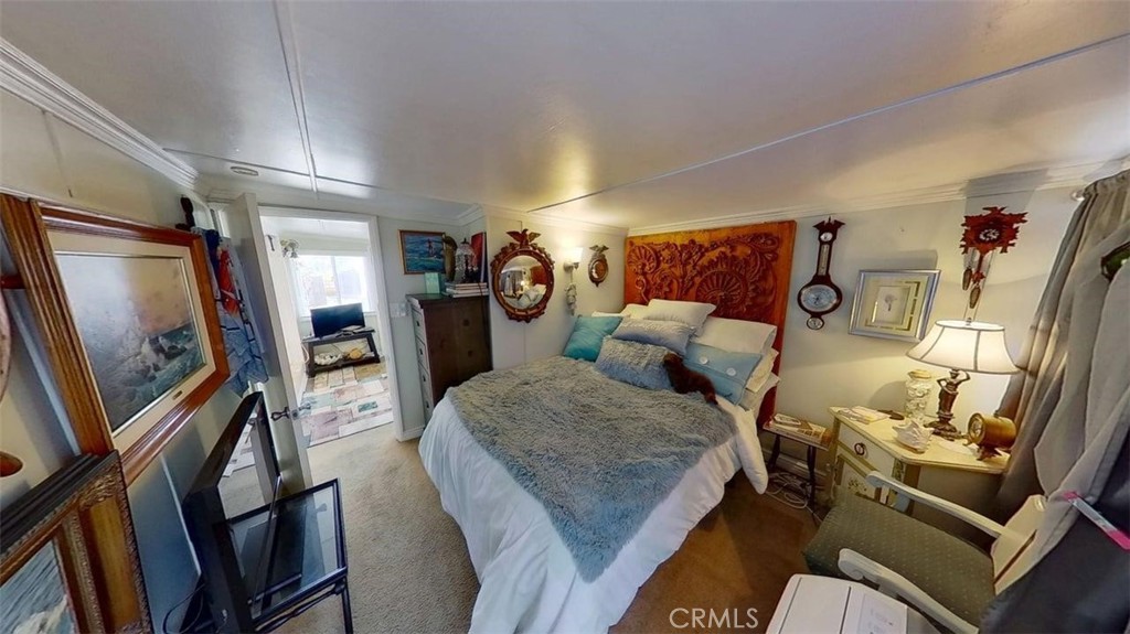 85 Riversea Road Seal Beach, CA 90740 - Photo 12 of 18 a living room with furniture and a flat screen tv