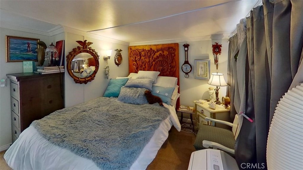85 Riversea Road Seal Beach, CA 90740 - Photo 13 of 18 a bedroom with a bed and a closet