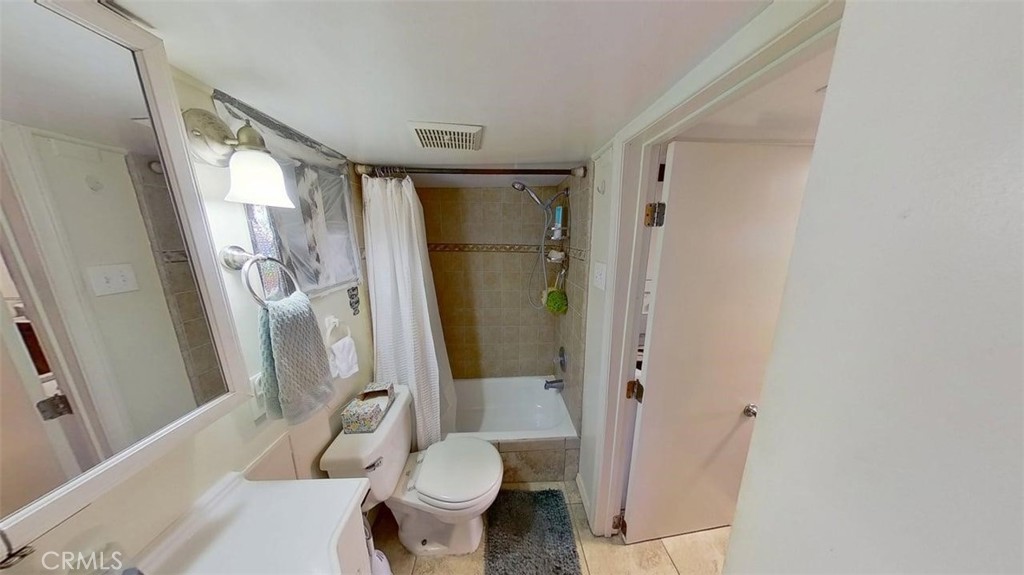 85 Riversea Road Seal Beach, CA 90740 - Photo 15 of 18 a bathroom with a sink toilet and shower
