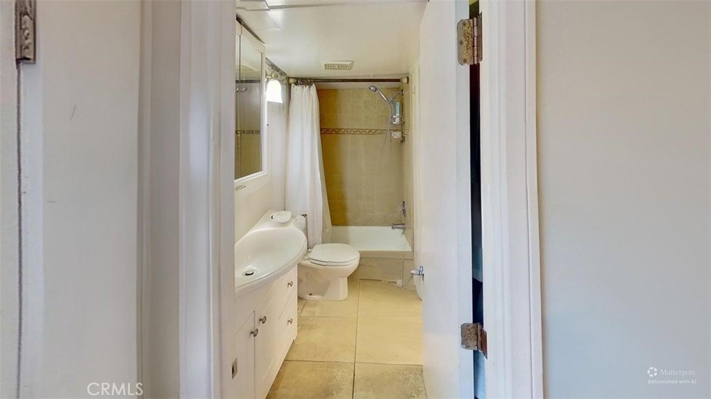 85 Riversea Road Seal Beach, CA 90740 - Photo 17 of 18 a bathroom with a toilet and a shower