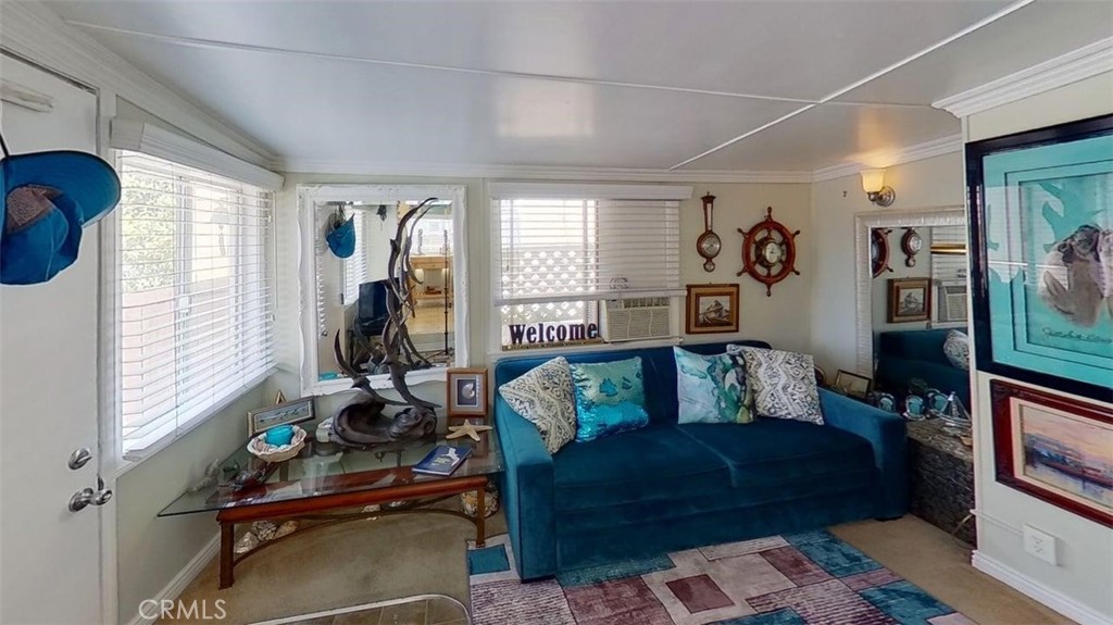 85 Riversea Road Seal Beach, CA 90740 - Photo 3 of 18 a living room with furniture and a window