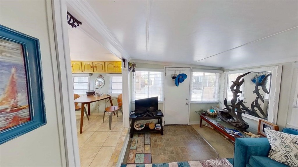 85 Riversea Road Seal Beach, CA 90740 - Photo 4 of 18 a living room with furniture and a flat screen tv