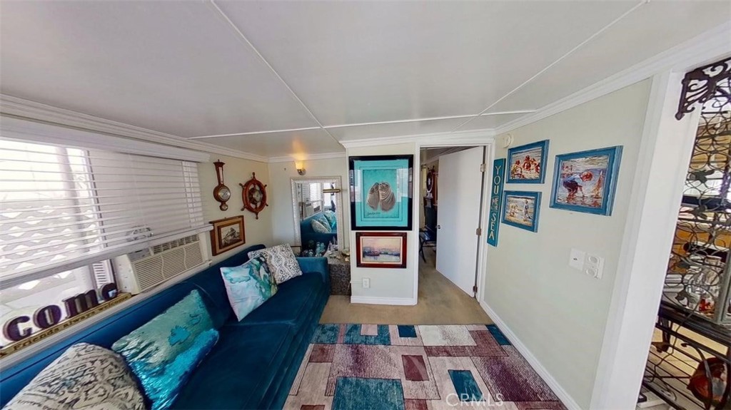 85 Riversea Road Seal Beach, CA 90740 - Photo 5 of 18 a living room with furniture and a rug