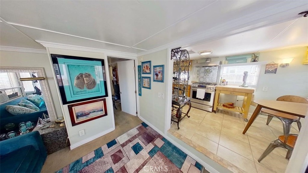 85 Riversea Road Seal Beach, CA 90740 - Photo 6 of 18 a living room with furniture and a flat screen tv