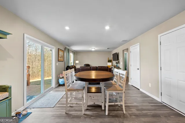 a kitchen with granite countertop a refrigerator stove and microwave