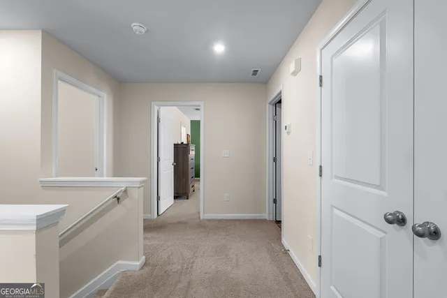 a bedroom with a bed dresser and a window