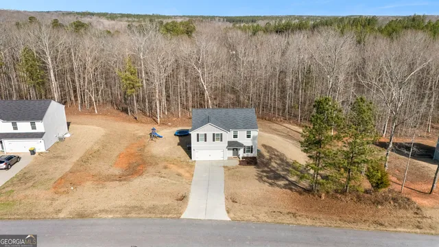 a view of a backyard of the house