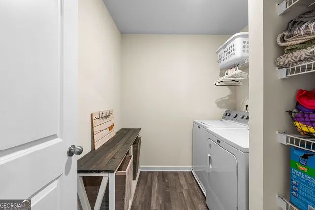 a bedroom with furniture and a wooden floor