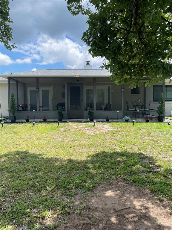 575 Tiberon Cove Road Longwood, FL 32750 - Photo 52 of 56 a view of a house with swimming pool and a yard
