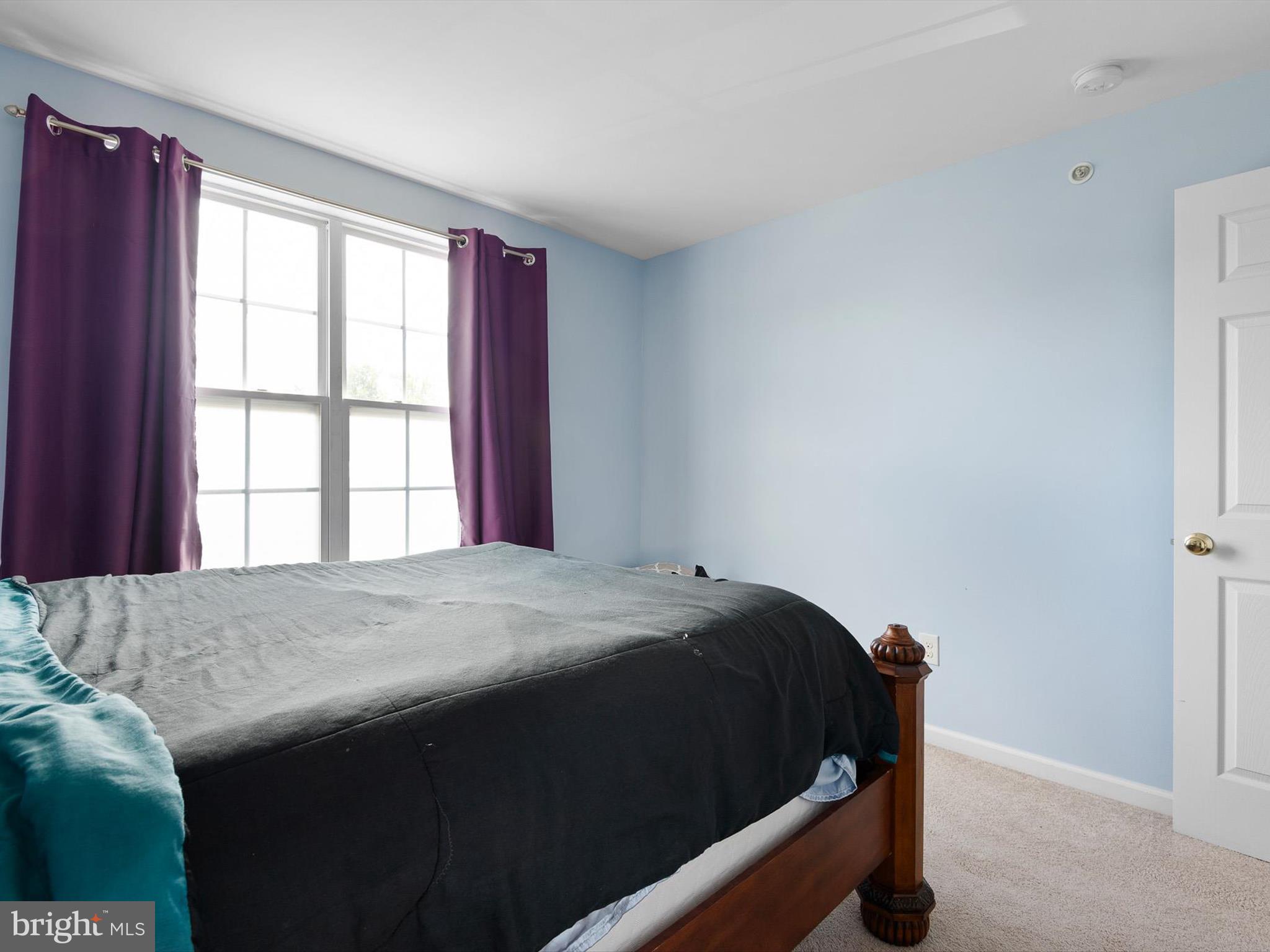 1092 Worth Lane, Unit BL12 Claymont, DE 19703 - Photo 14 of 20 a bedroom with a bed and a window