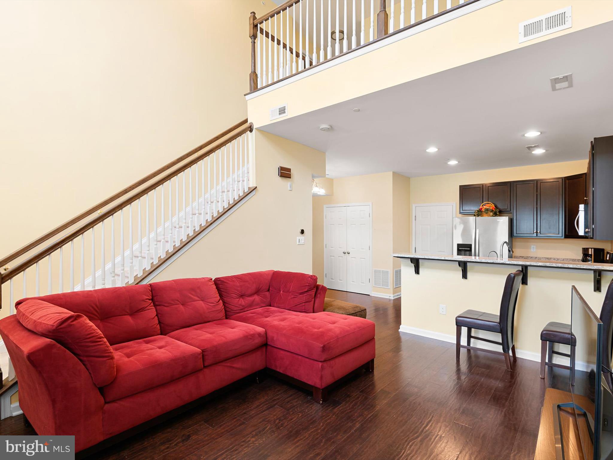 1092 Worth Lane, Unit BL12 Claymont, DE 19703 - Photo 2 of 20 a living room with furniture a wooden floor and a sink