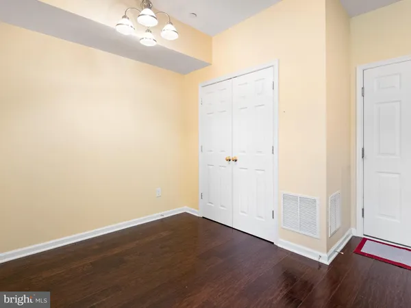 an empty room with wooden floor