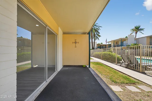 front view of a house with potted plants