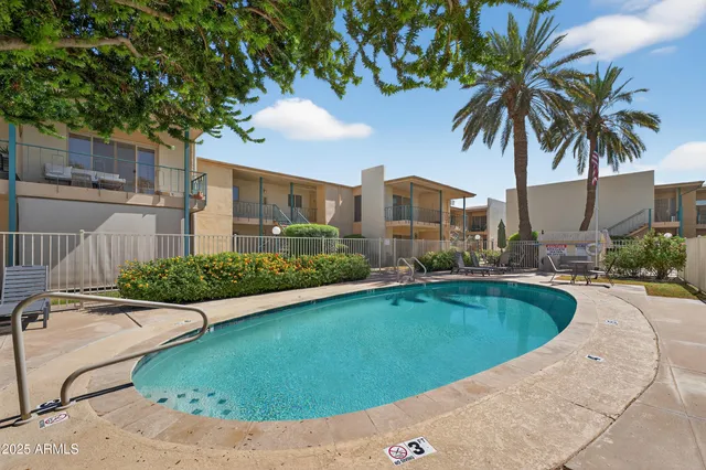 a house with palm tree in front of it