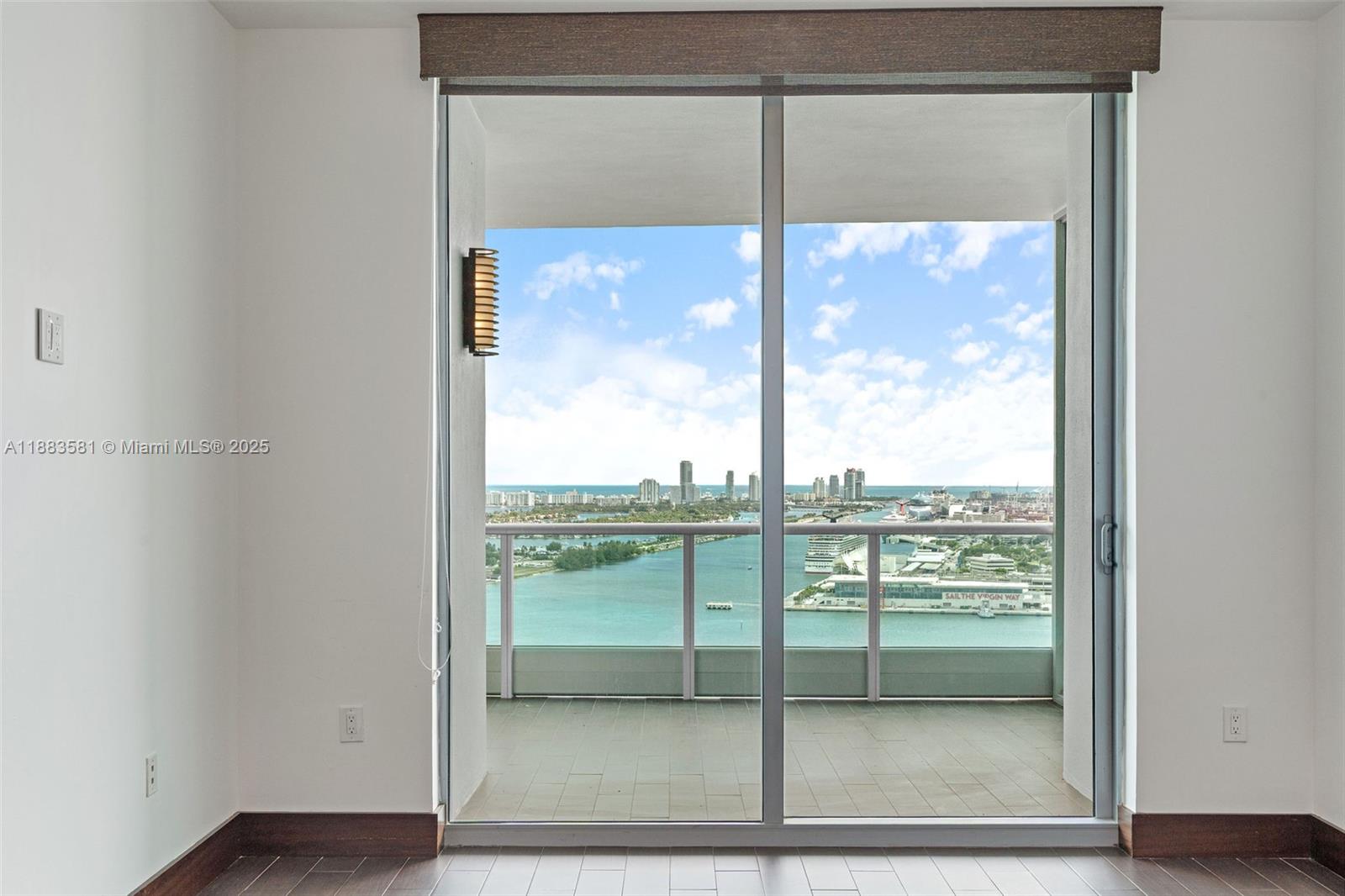 900 Biscayne Boulevard, Unit 3502 Miami, FL 33132 - Photo 16 of 42 a view of a glass door with a yard from the window