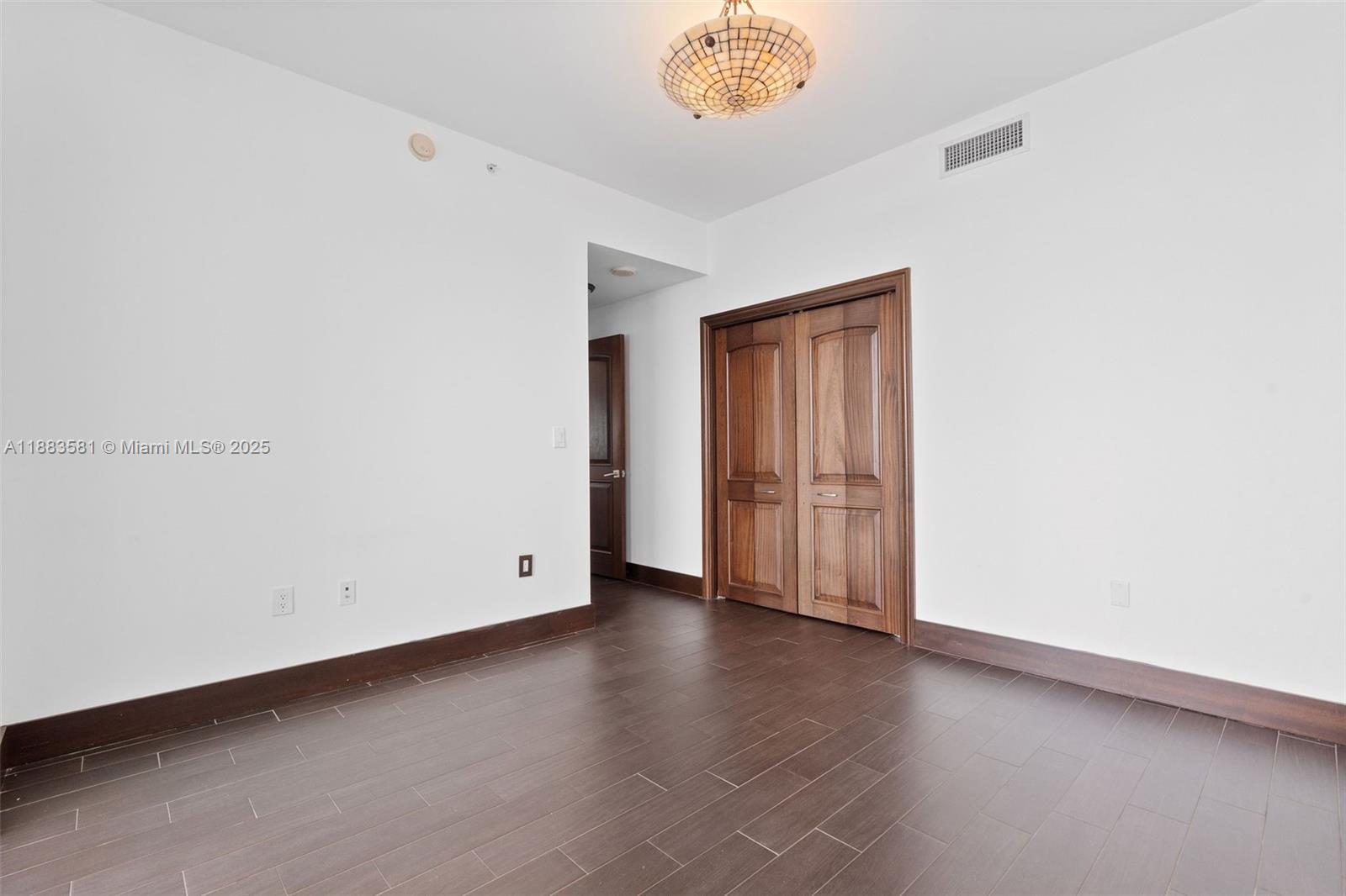 900 Biscayne Boulevard, Unit 3502 Miami, FL 33132 - Photo 34 of 42 a view of an empty room with wooden floor