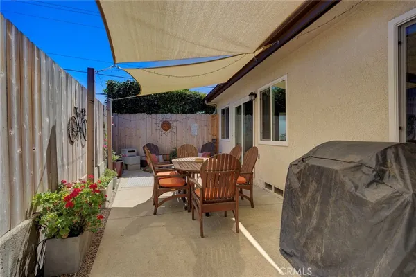 a outdoor living space with furniture and a potted plant