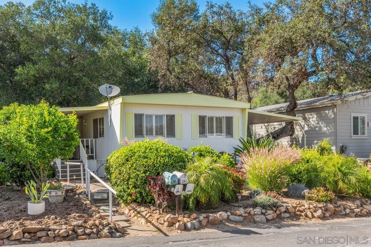 4747 Oak Crest Road, Unit 39 Fallbrook, CA 92028 - Photo 1 of 38 a view of house with a yard and potted plants