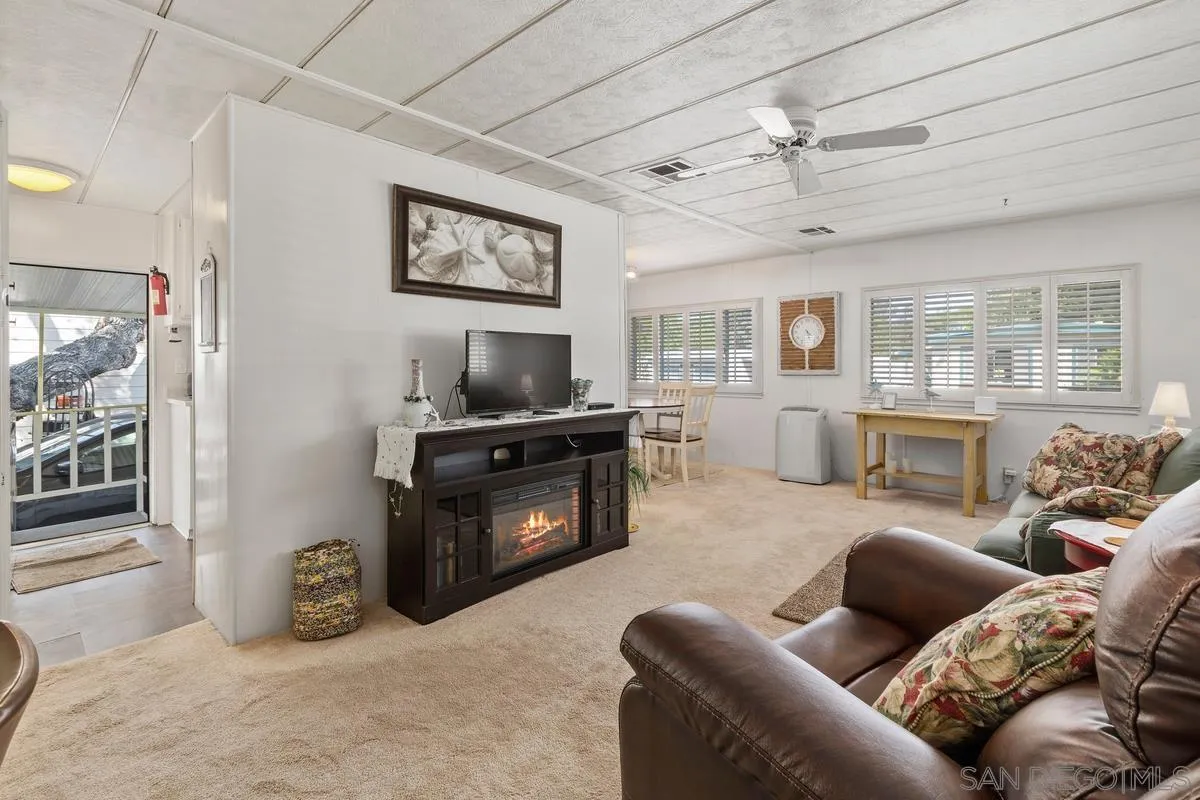 4747 Oak Crest Road, Unit 39 Fallbrook, CA 92028 - Photo 11 of 38 a living room with furniture and a fireplace