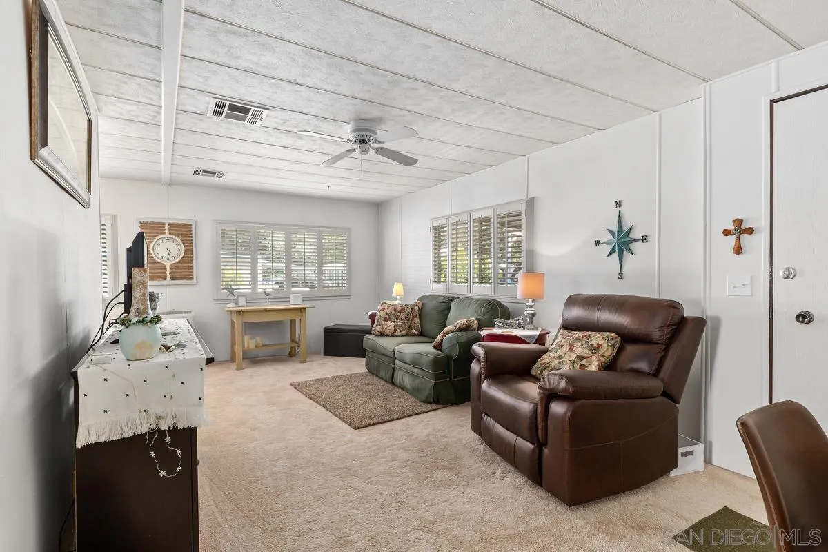 4747 Oak Crest Road, Unit 39 Fallbrook, CA 92028 - Photo 12 of 38 a living room with furniture and wooden floor