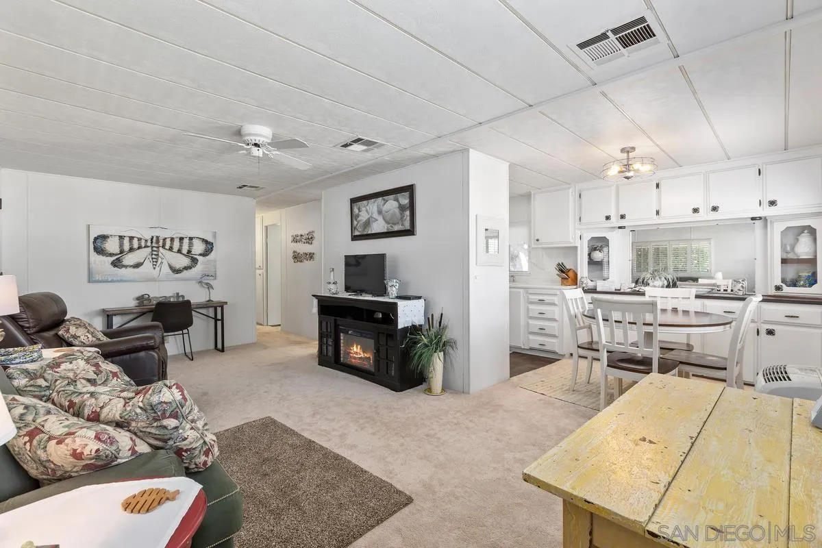4747 Oak Crest Road, Unit 39 Fallbrook, CA 92028 - Photo 14 of 38 a living room with furniture and a fireplace