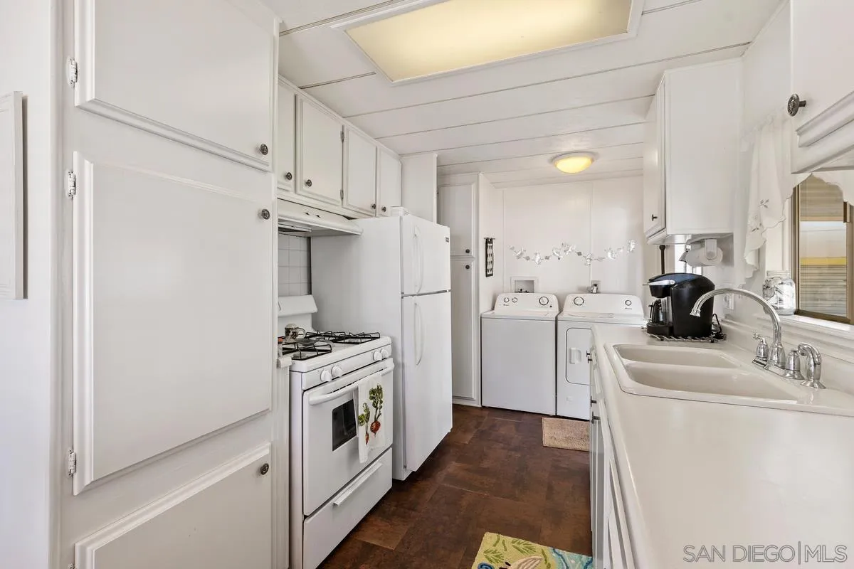 4747 Oak Crest Road, Unit 39 Fallbrook, CA 92028 - Photo 17 of 38 a kitchen with stainless steel appliances a stove a refrigerator and cabinets