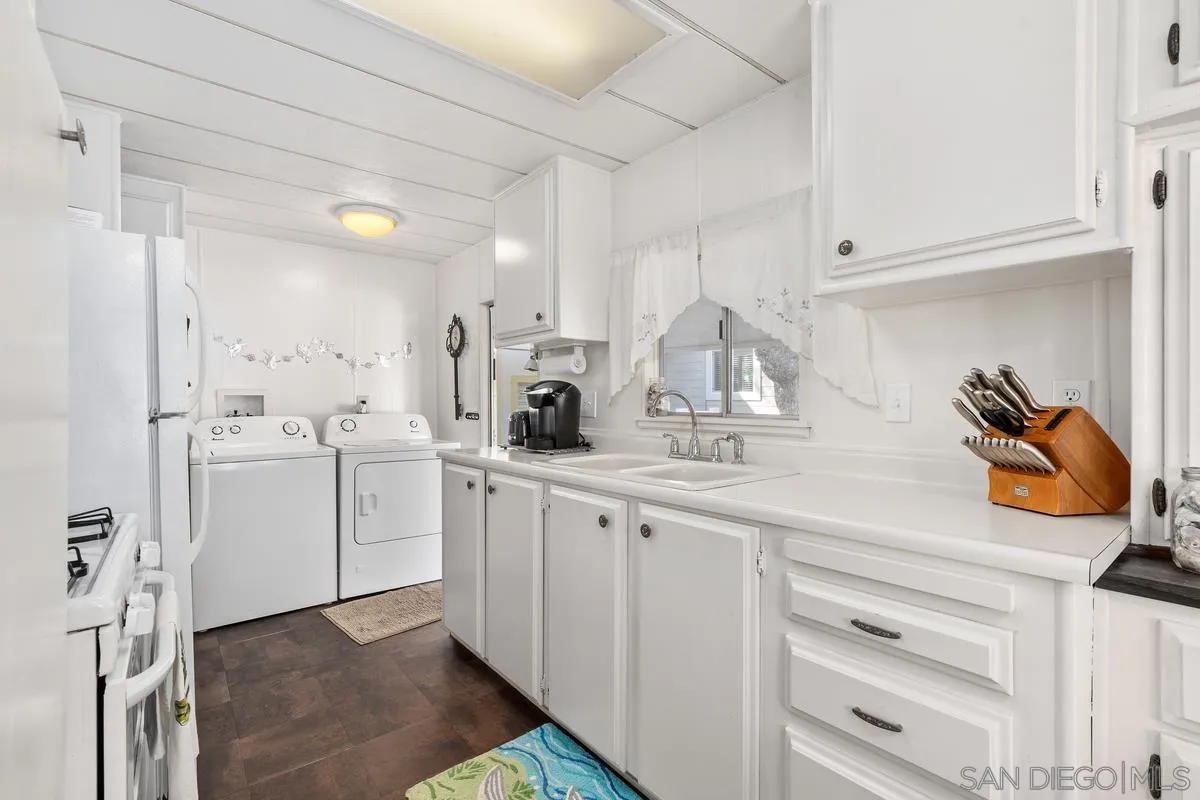 4747 Oak Crest Road, Unit 39 Fallbrook, CA 92028 - Photo 18 of 38 a kitchen with white cabinets and white appliances