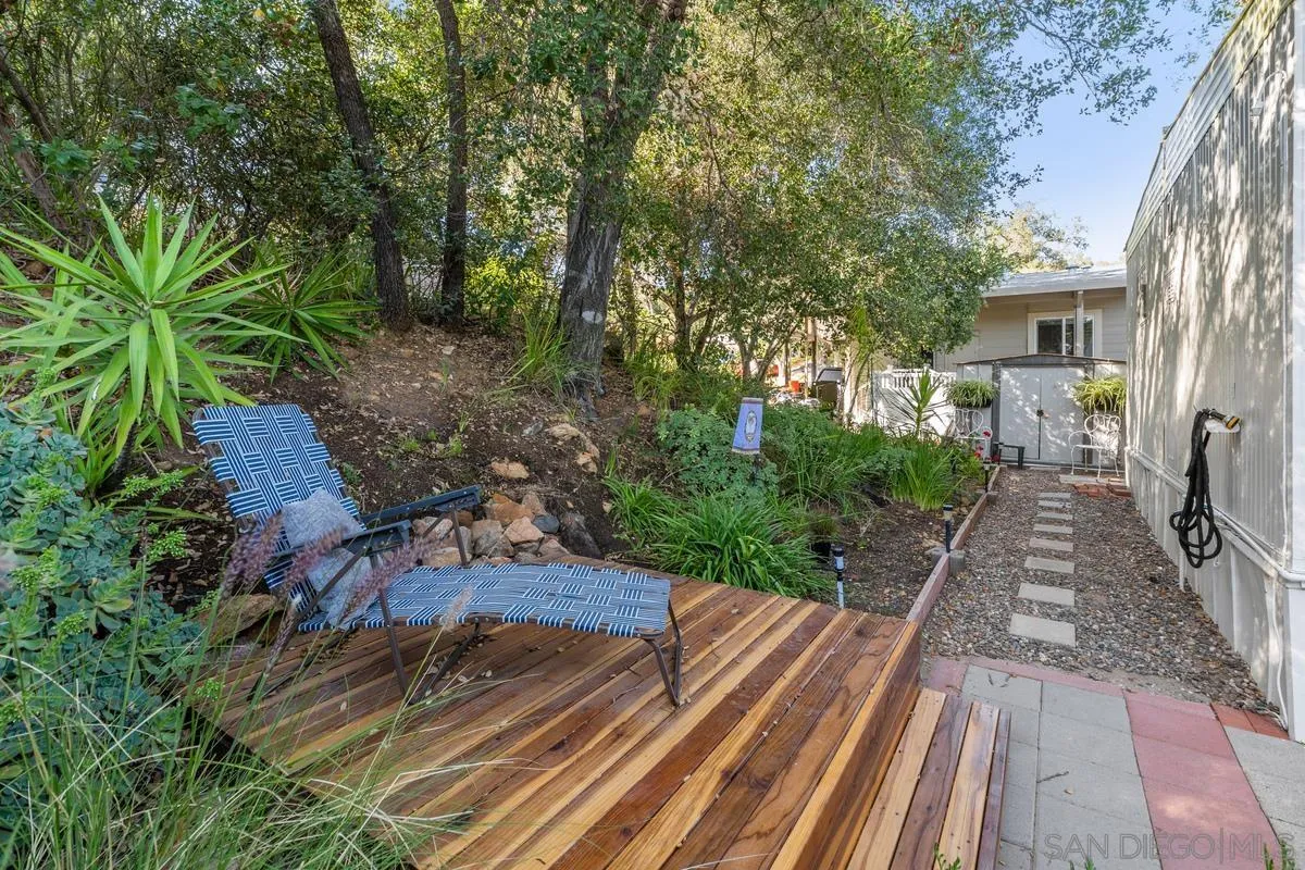 4747 Oak Crest Road, Unit 39 Fallbrook, CA 92028 - Photo 27 of 38 a view of a backyard with sitting area