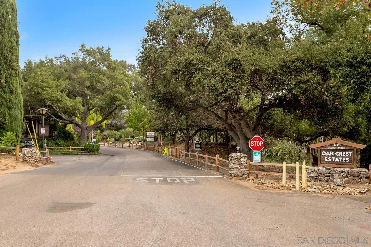 4747 Oak Crest Road, Unit 39 Fallbrook, CA 92028 - Photo 33 of 38 a sign board with a trees in the background
