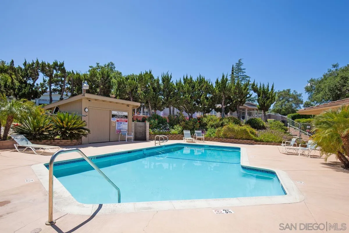 4747 Oak Crest Road, Unit 39 Fallbrook, CA 92028 - Photo 37 of 38 a view of a swimming pool with a yard