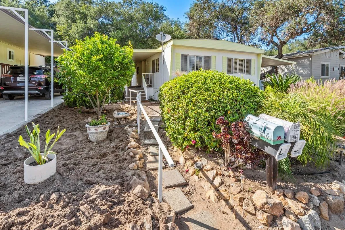 4747 Oak Crest Road, Unit 39 Fallbrook, CA 92028 - Photo 6 of 38 a front view of a house with garden