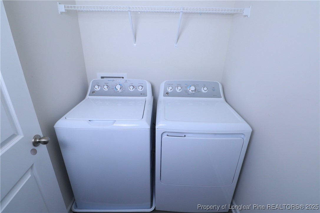 96 Cutty Way Lillington, NC 27546 - Photo 15 of 37 a utility room with dryer and washer