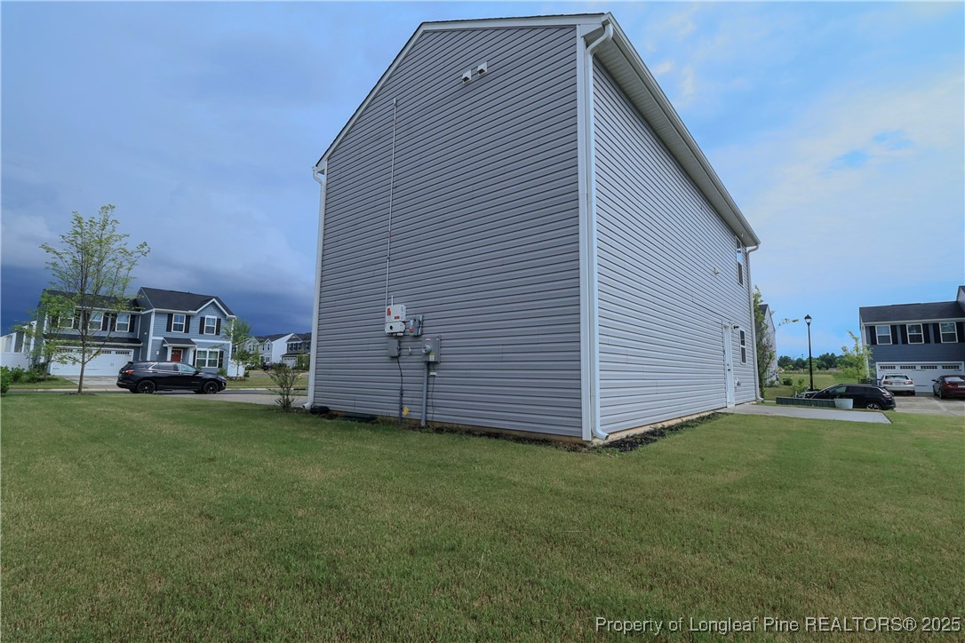 96 Cutty Way Lillington, NC 27546 - Photo 18 of 37 a view of a house with a yard