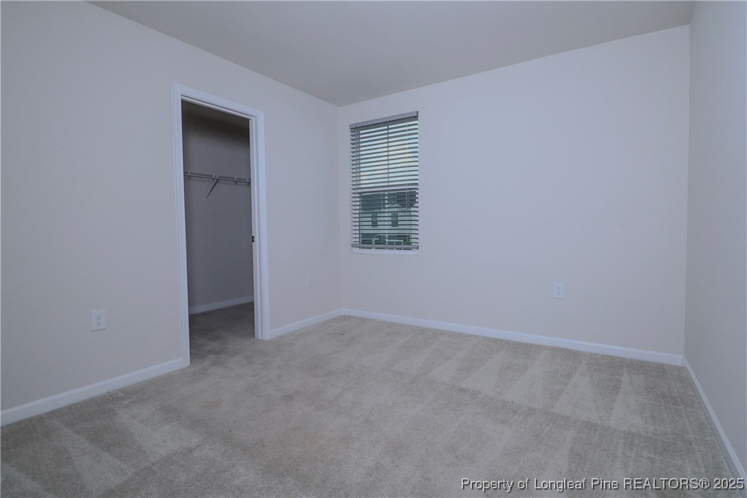 96 Cutty Way Lillington, NC 27546 - Photo 21 of 37 an empty room with windows