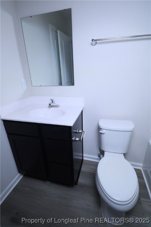 96 Cutty Way Lillington, NC 27546 - Photo 29 of 37 a bathroom with a toilet a sink and mirror