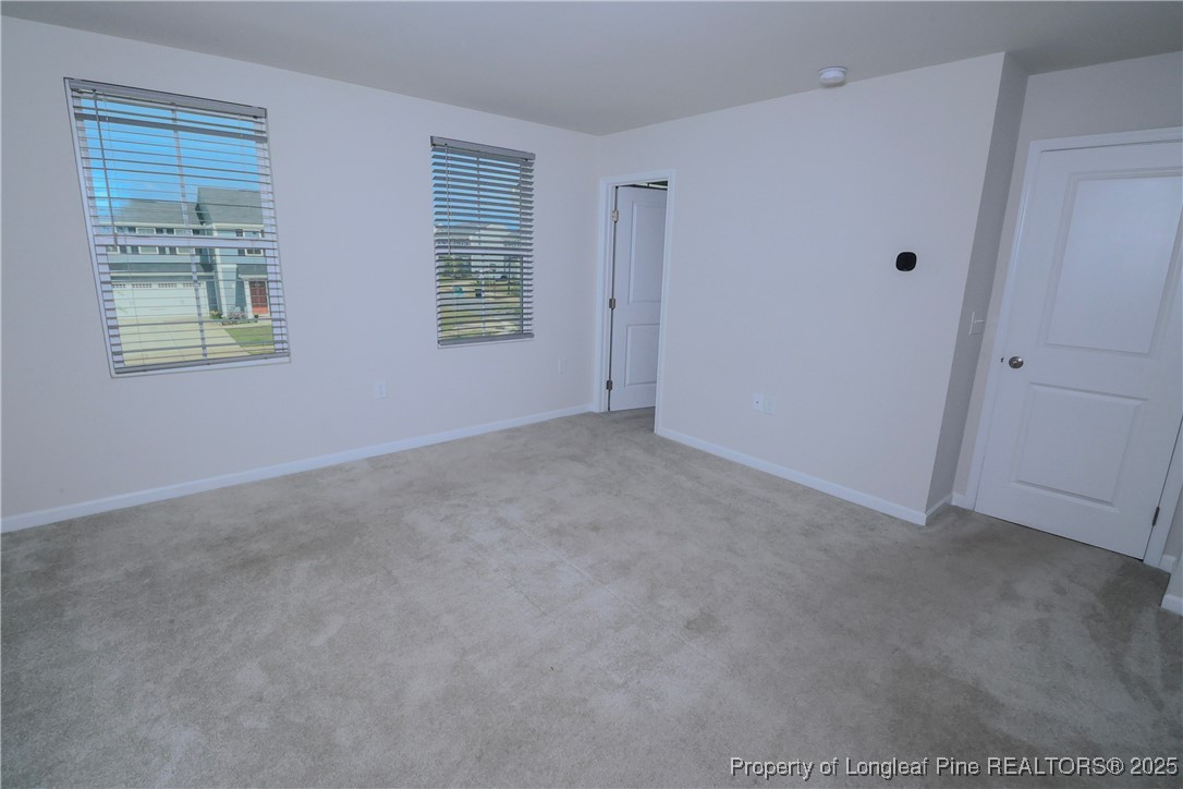 96 Cutty Way Lillington, NC 27546 - Photo 30 of 37 an empty room with windows