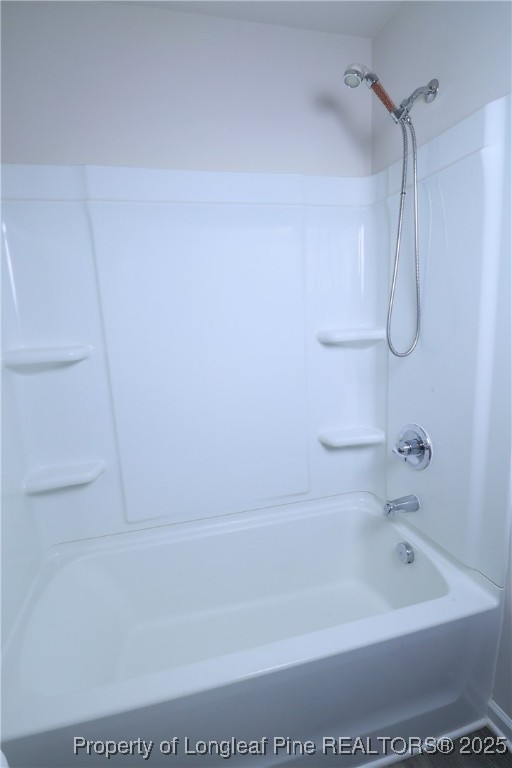 96 Cutty Way Lillington, NC 27546 - Photo 32 of 37 a close up of a bathtub in a bathroom