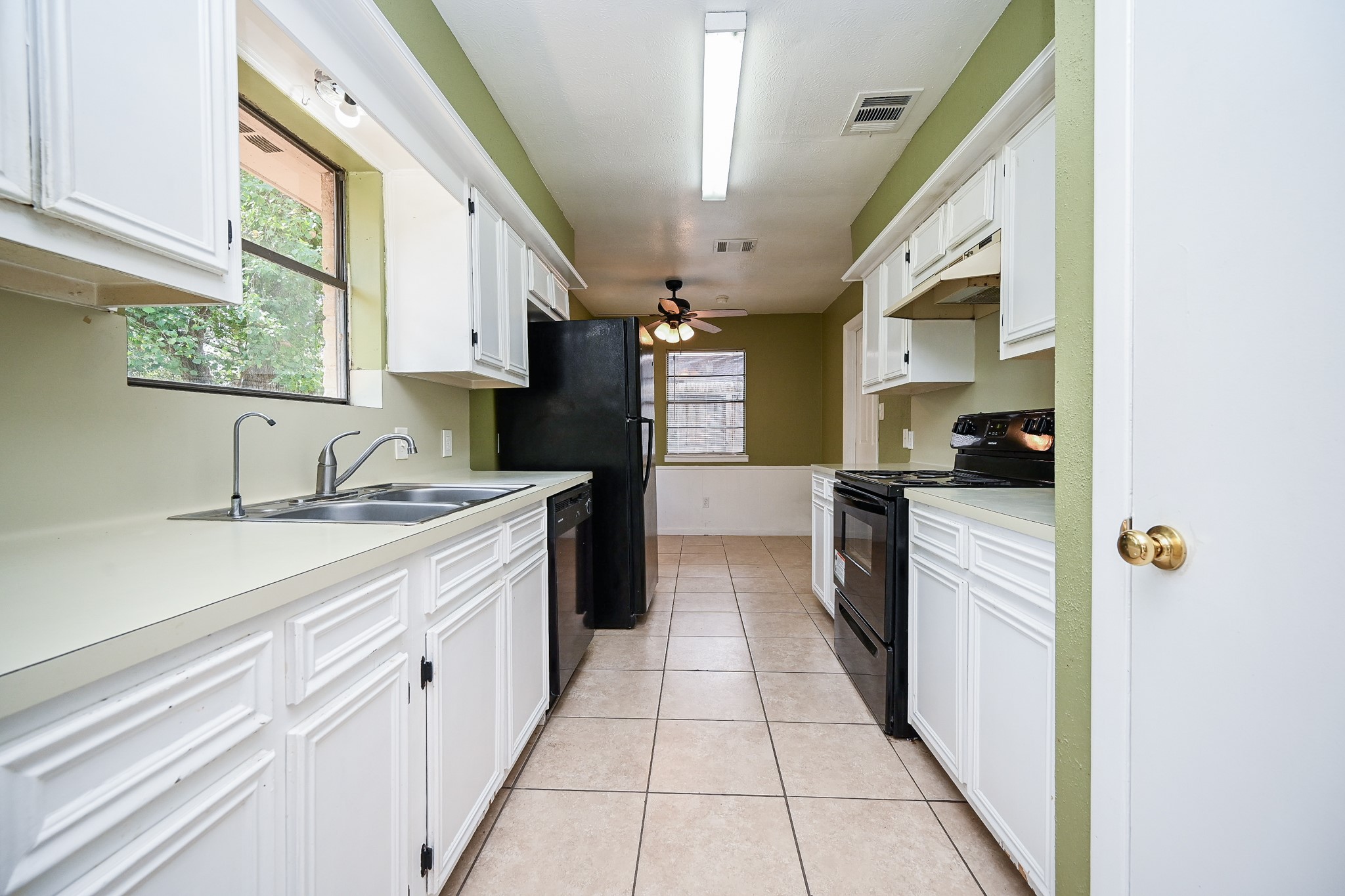6634 Bridgegate Drive Spring, TX 77373 - Photo 6 of 16 a kitchen with stainless steel appliances granite countertop a sink and cabinets