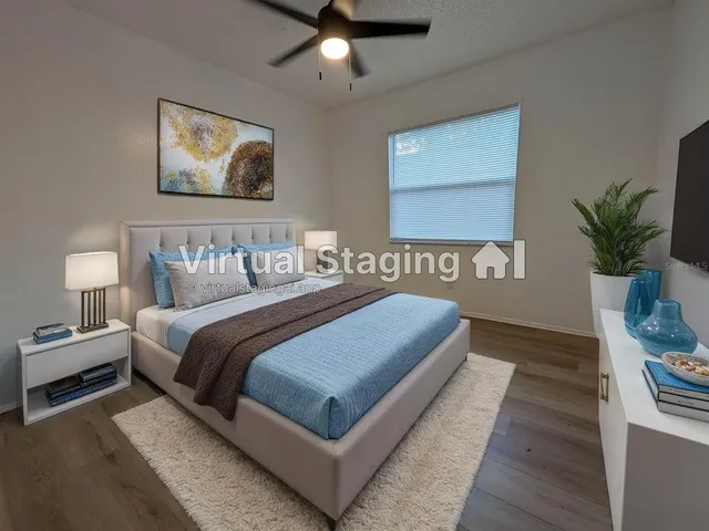 a bedroom with bed and window