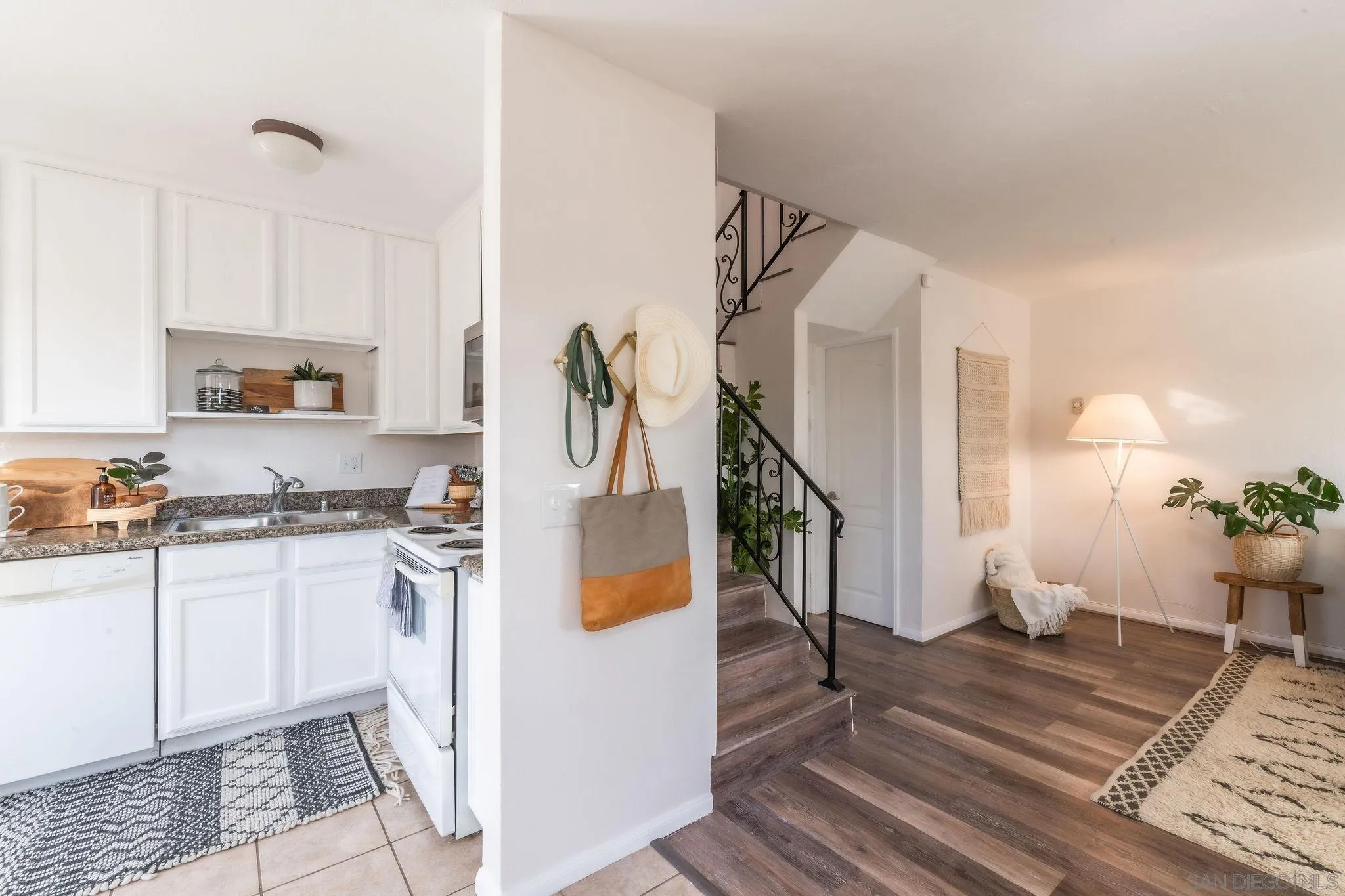 10235 Madrid Way, Unit 138 Spring Valley, CA 91977 - Photo 12 of 21 a kitchen with stainless steel appliances kitchen island granite countertop a refrigerator a stove a sink and a counter space