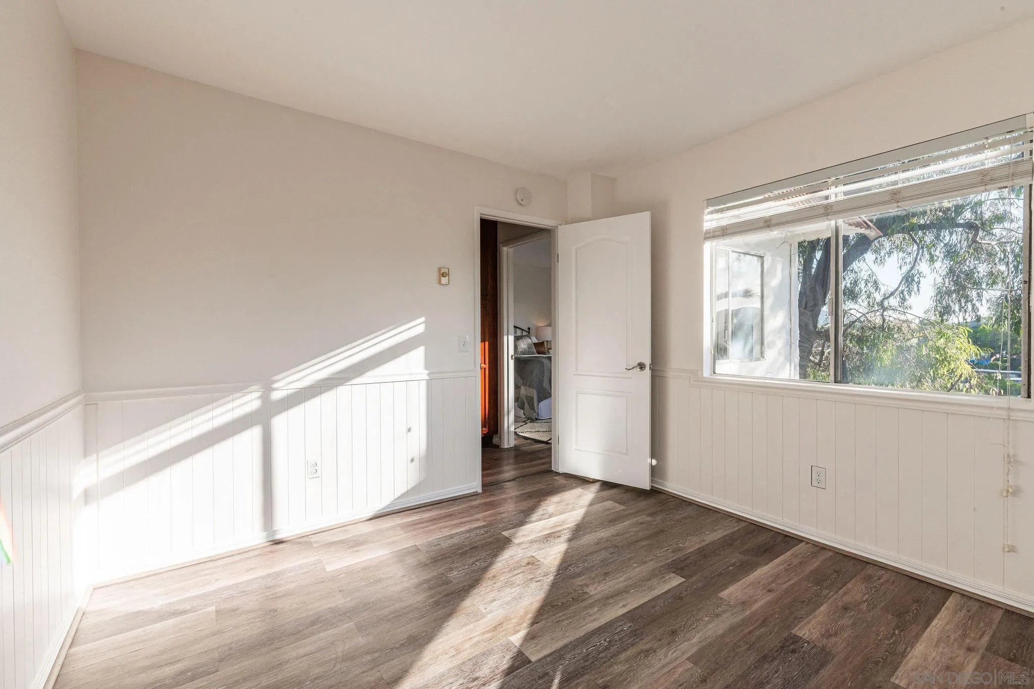 10235 Madrid Way, Unit 138 Spring Valley, CA 91977 - Photo 15 of 21 a view of empty room with wooden floor and fan