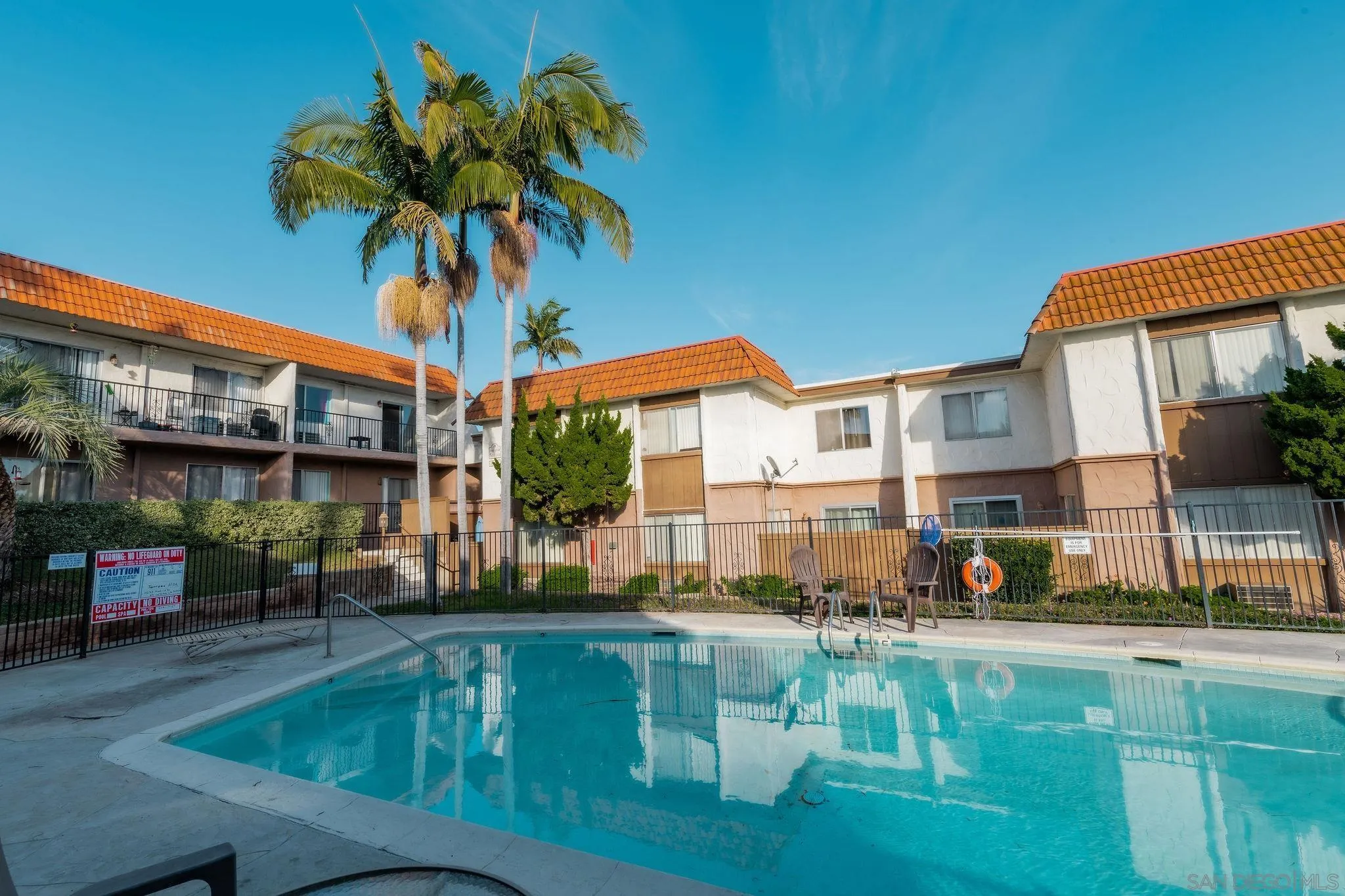 10235 Madrid Way, Unit 138 Spring Valley, CA 91977 - Photo 20 of 21 a swimming pool view with a outdoor seating