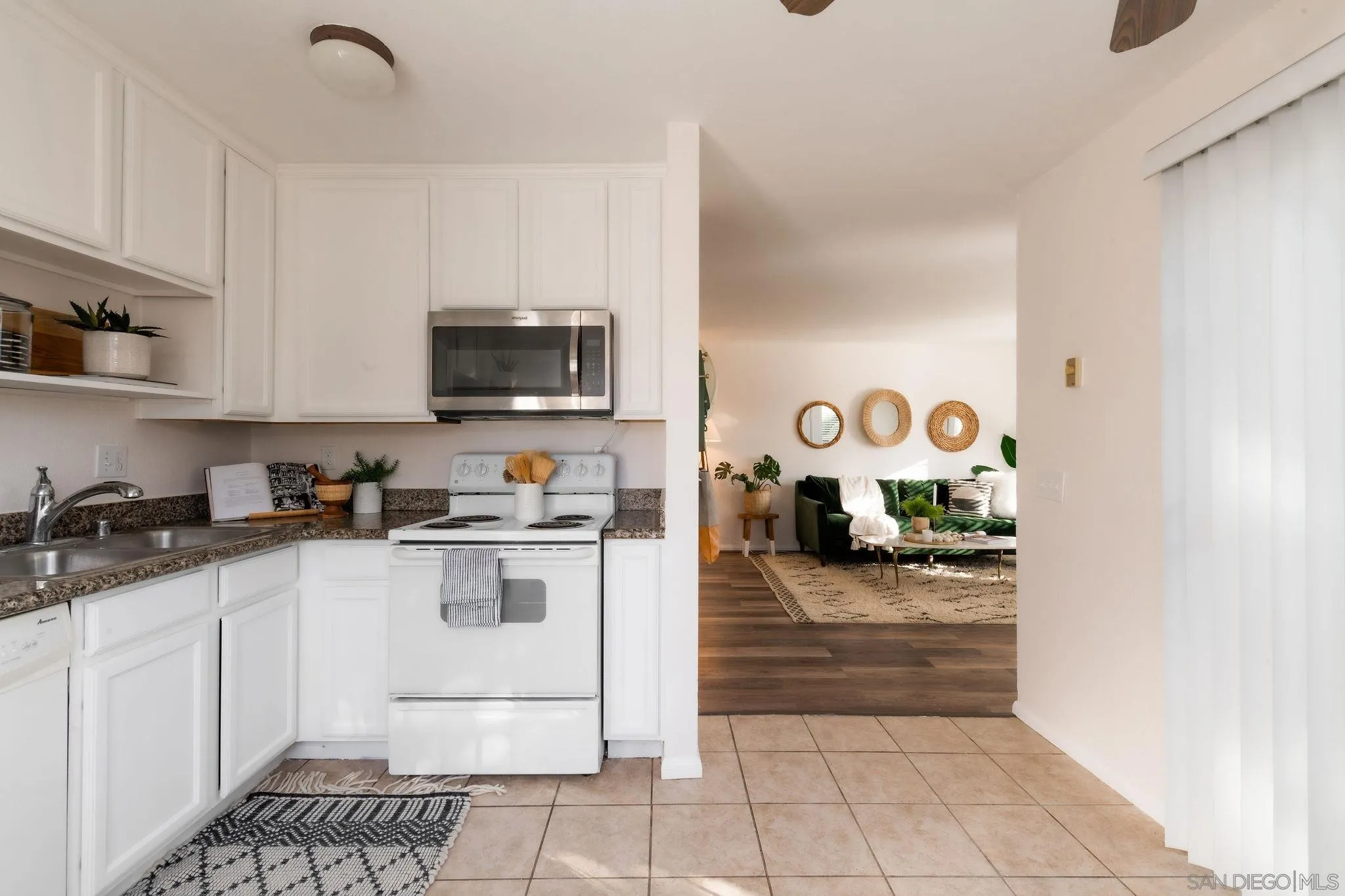 10235 Madrid Way, Unit 138 Spring Valley, CA 91977 - Photo 10 of 21 a kitchen with granite countertop a stove and a sink