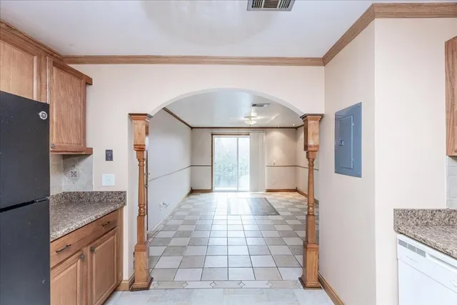 a kitchen with stainless steel appliances a refrigerator and a stove top oven