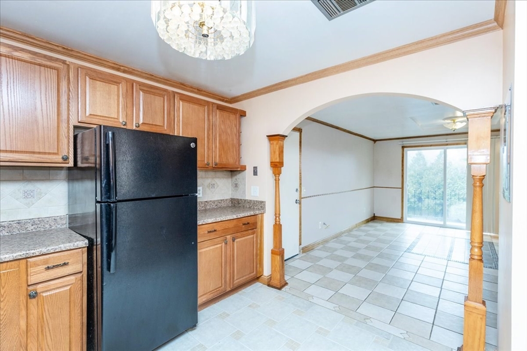176 Maple Avenue, Unit 138 Rutland, MA 01543 - Photo 15 of 29 a kitchen with stainless steel appliances a refrigerator and a stove top oven