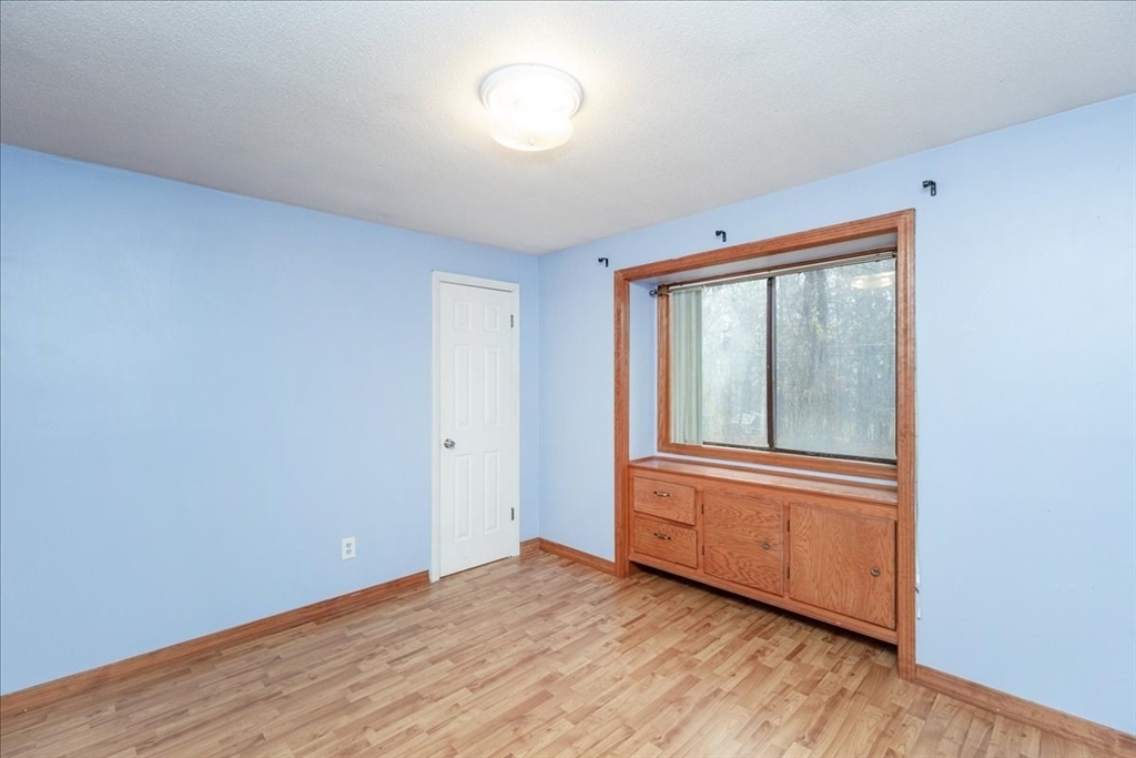176 Maple Avenue, Unit 138 Rutland, MA 01543 - Photo 17 of 29 a view of a room with wooden floor and windows